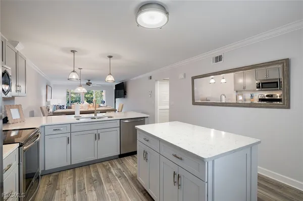 a kitchen with a sink and cabinets