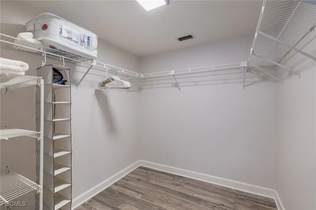 a view of storage and utility room with racks on the wall