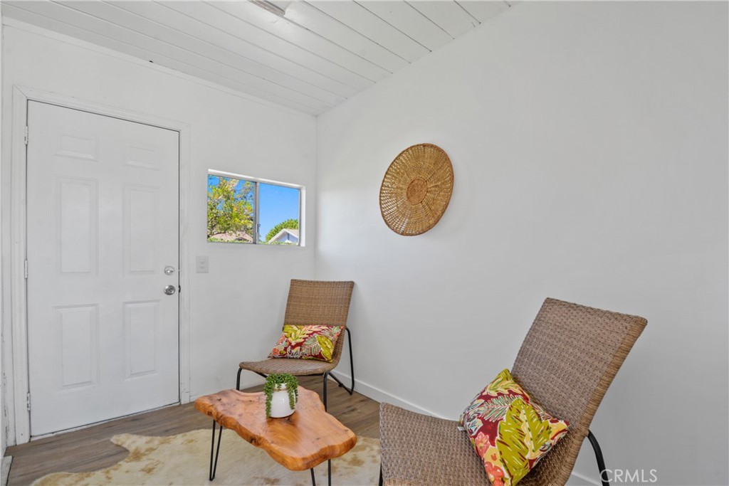 2463 Valhalla Street Pomona, CA 91767 - Photo 12 of 18 a view of a workspace with furniture and wooden floor