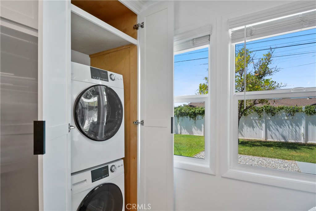 2463 Valhalla Street Pomona, CA 91767 - Photo 7 of 18 a view of a hallway with wooden floor and a fireplace