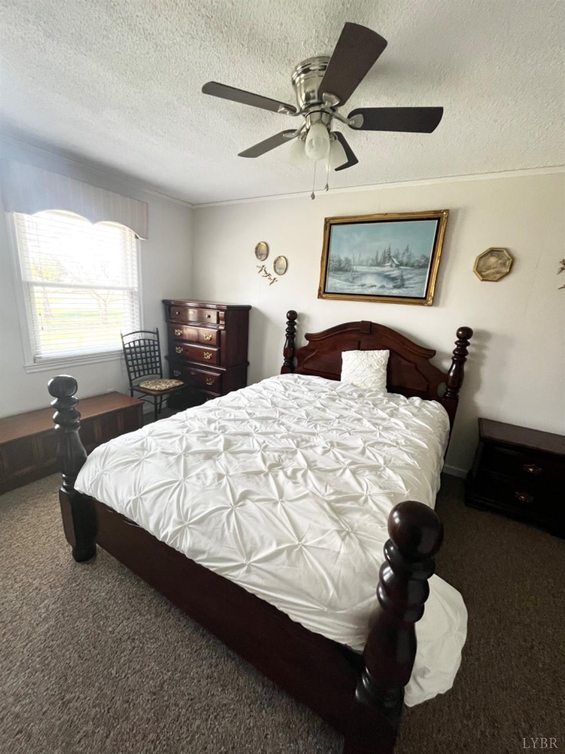 265 Fairview Road Chatham, VA 24531 - Photo 42 of 88 a bed sitting in a bedroom next to a window