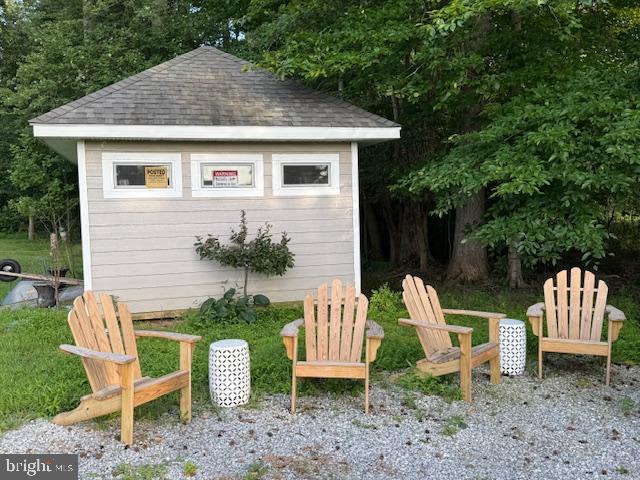 10105 Morgantown Road Newburg, MD 20664 - Photo 13 of 15 a front view of a house with a yard chairs and a fountain
