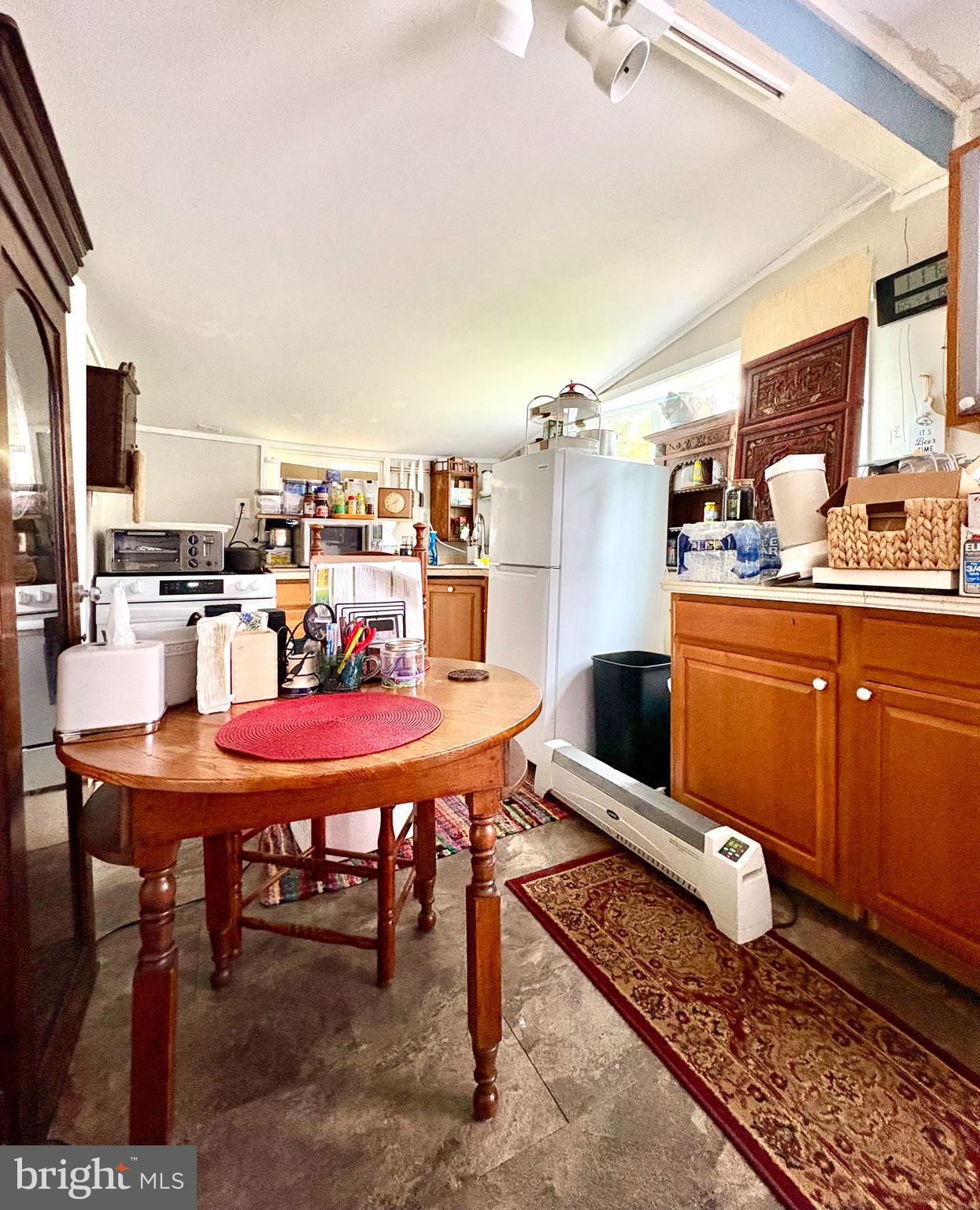10105 Morgantown Road Newburg, MD 20664 - Photo 5 of 15 a living room with a table and chairs