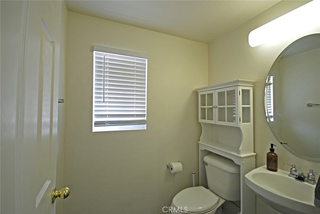 25745 Perlman Place, Unit A Stevenson Ranch, CA 91381 - Photo 12 of 28 a bathroom with a toilet sink vanity and tub