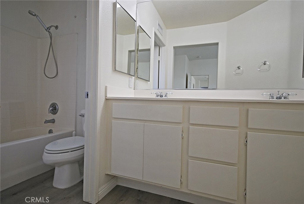 25745 Perlman Place, Unit A Stevenson Ranch, CA 91381 - Photo 15 of 28 a bathroom with a sink a toilet and shower