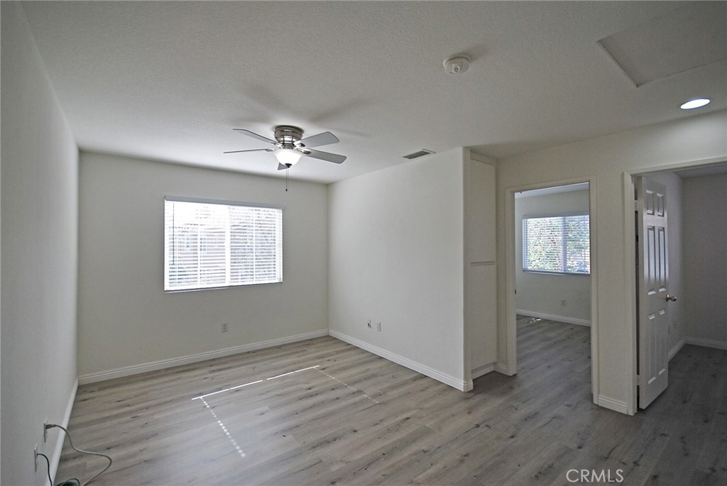 25745 Perlman Place, Unit A Stevenson Ranch, CA 91381 - Photo 16 of 28 wooden floor in an empty room with a window