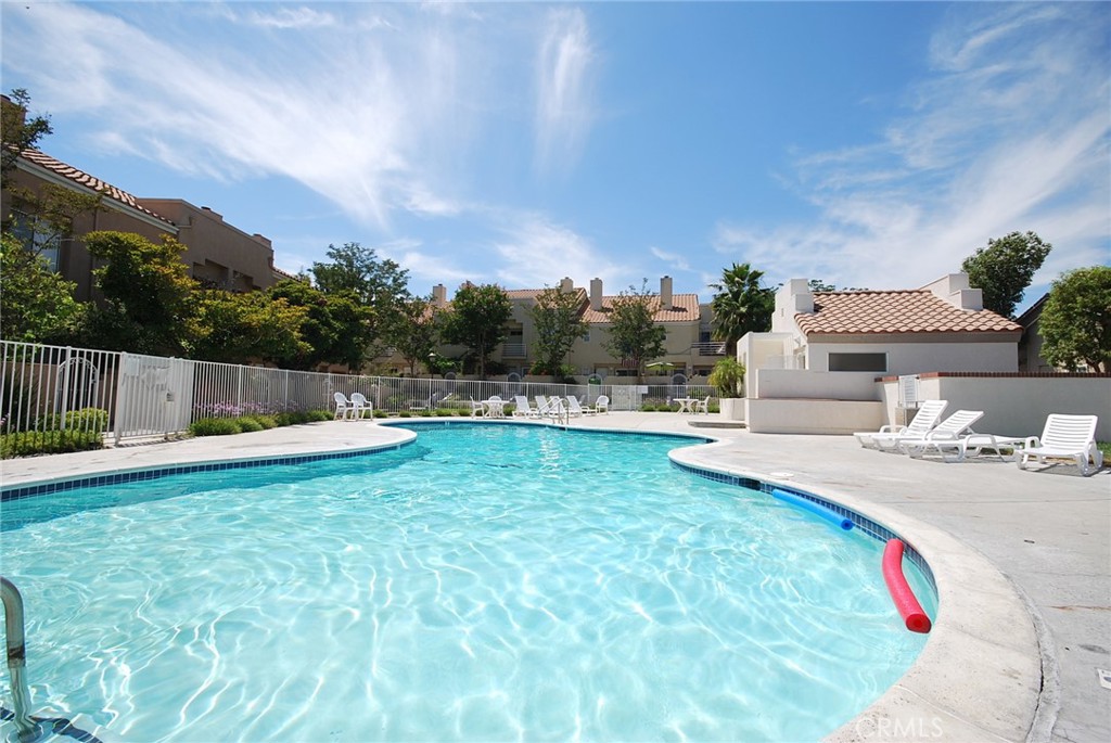 25745 Perlman Place, Unit A Stevenson Ranch, CA 91381 - Photo 27 of 28 a view of a backyard with swimming pool