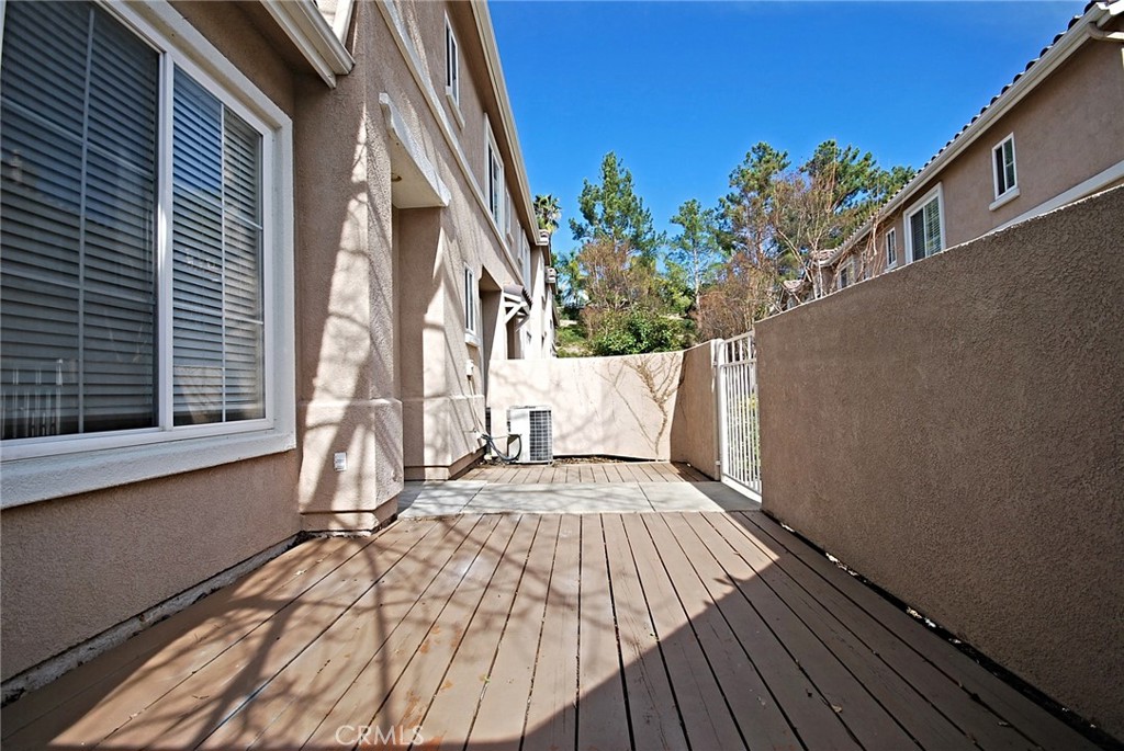 25745 Perlman Place, Unit A Stevenson Ranch, CA 91381 - Photo 3 of 28 a view of balcony with wooden floor and outdoor space