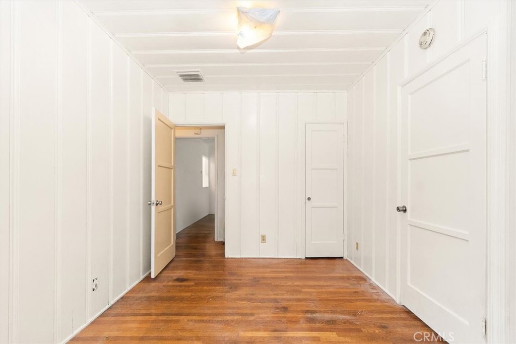 14248 Friar Street Van Nuys, CA 91401 - Photo 19 of 36 a view of a hallway with wooden floor