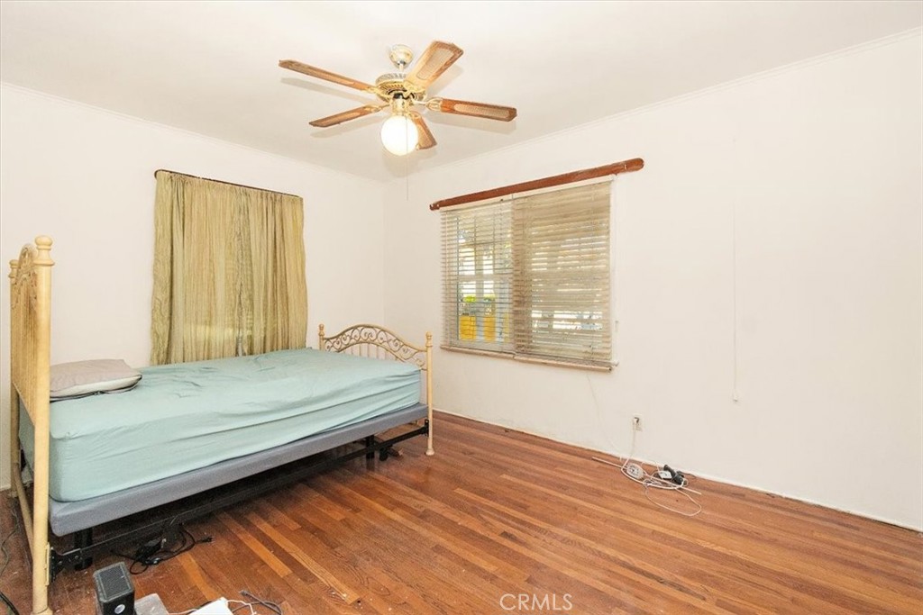 14248 Friar Street Van Nuys, CA 91401 - Photo 20 of 36 a bedroom with a bed and a window