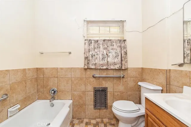 a bathroom with a bathtub and sink