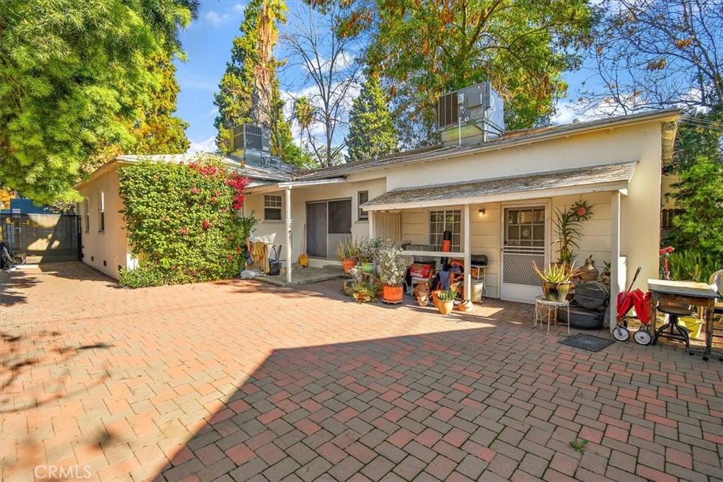 14248 Friar Street Van Nuys, CA 91401 - Photo 27 of 36 a view of a patio with table and chairs under an umbrella