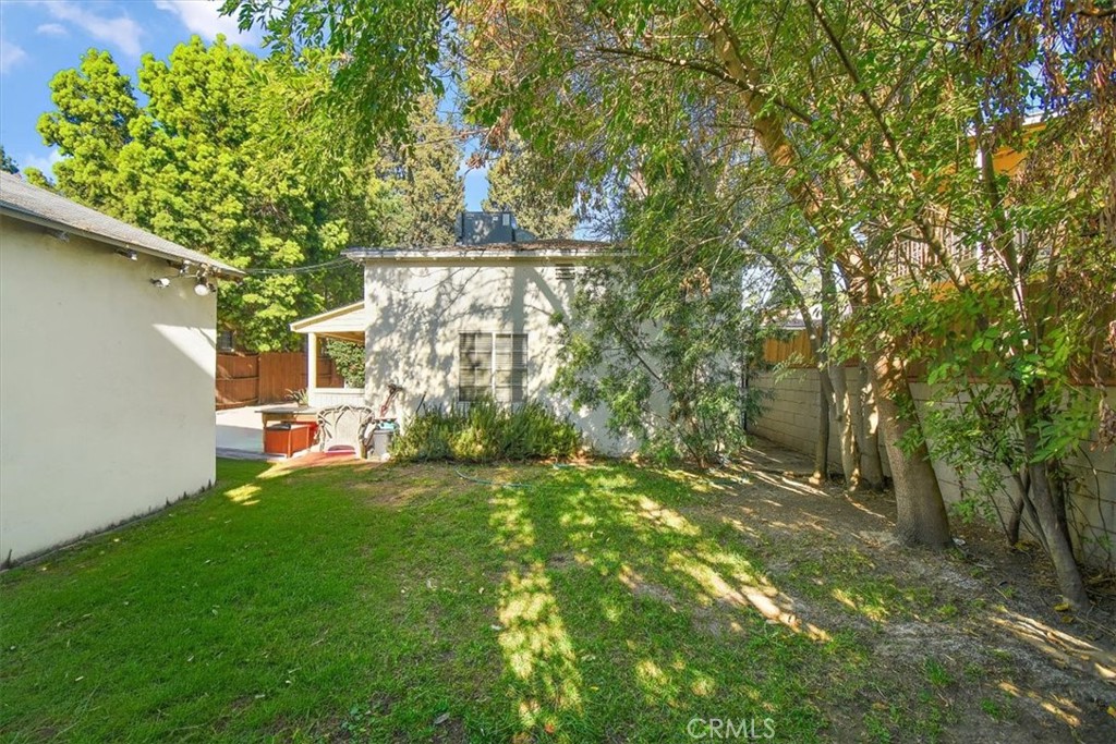 14248 Friar Street Van Nuys, CA 91401 - Photo 34 of 36 a backyard of a house with table and chairs