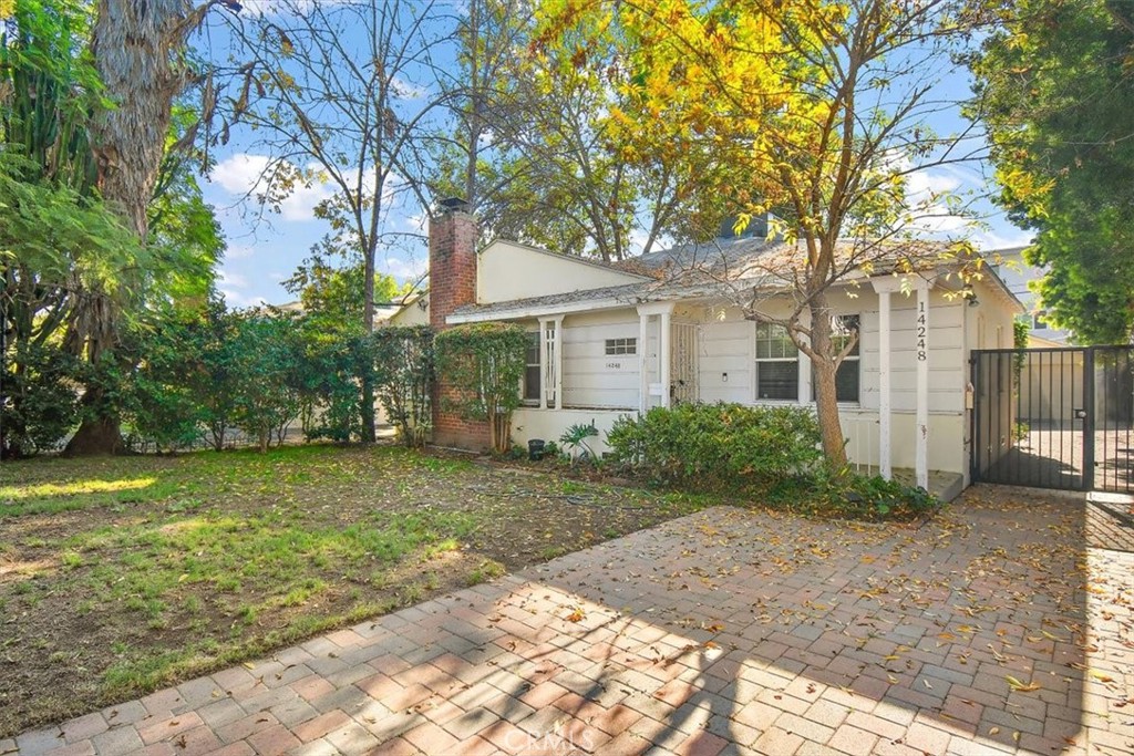 14248 Friar Street Van Nuys, CA 91401 - Photo 35 of 36 a front view of a house with garden