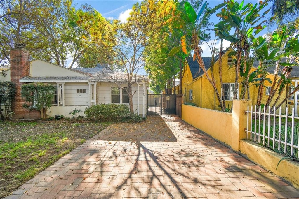 14248 Friar Street Van Nuys, CA 91401 - Photo 36 of 36 a view of backyard with a garden and trees