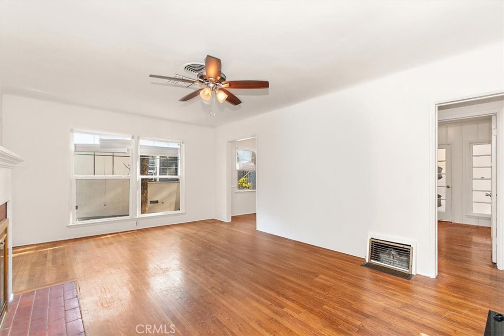 14248 Friar Street Van Nuys, CA 91401 - Photo 6 of 36 a view of empty room with wooden floor and fan