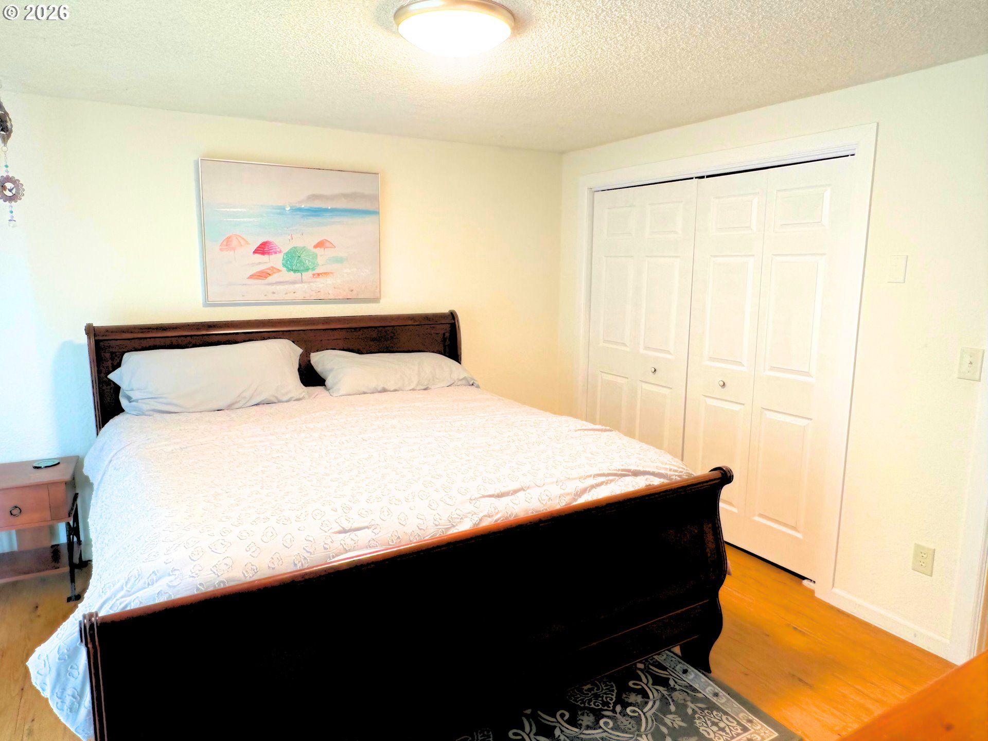 1708 Jasper Avenue Sutherlin, OR 97479 - Photo 13 of 30 a bedroom with a bed and a painting on the wall