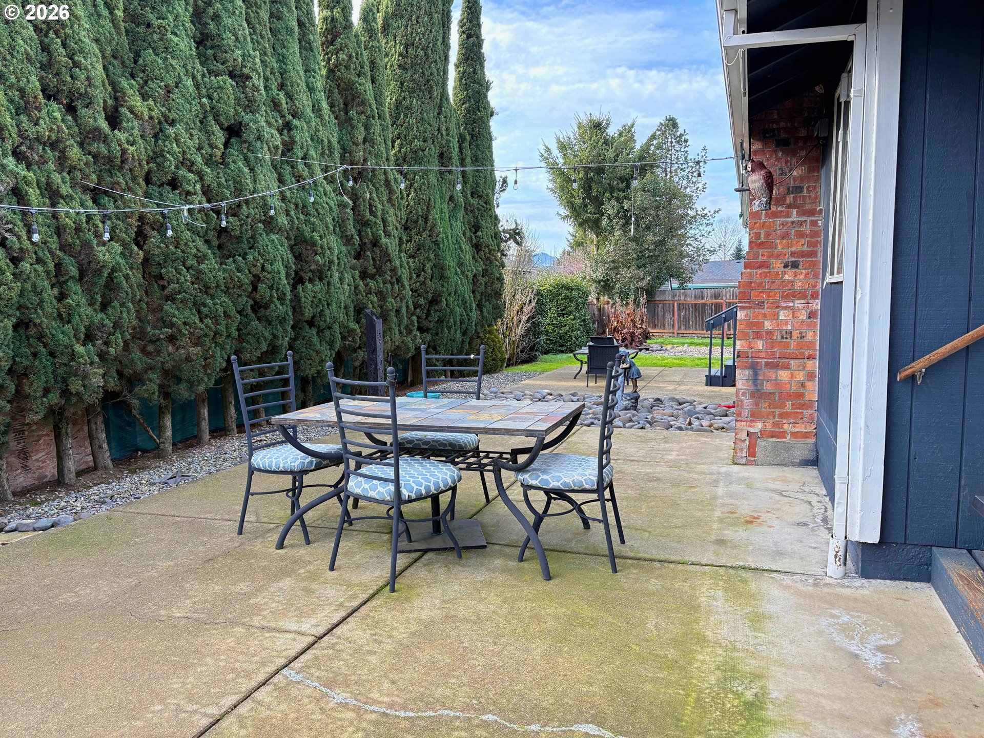 1708 Jasper Avenue Sutherlin, OR 97479 - Photo 27 of 30 a view of a tables and chairs in back yard of the house