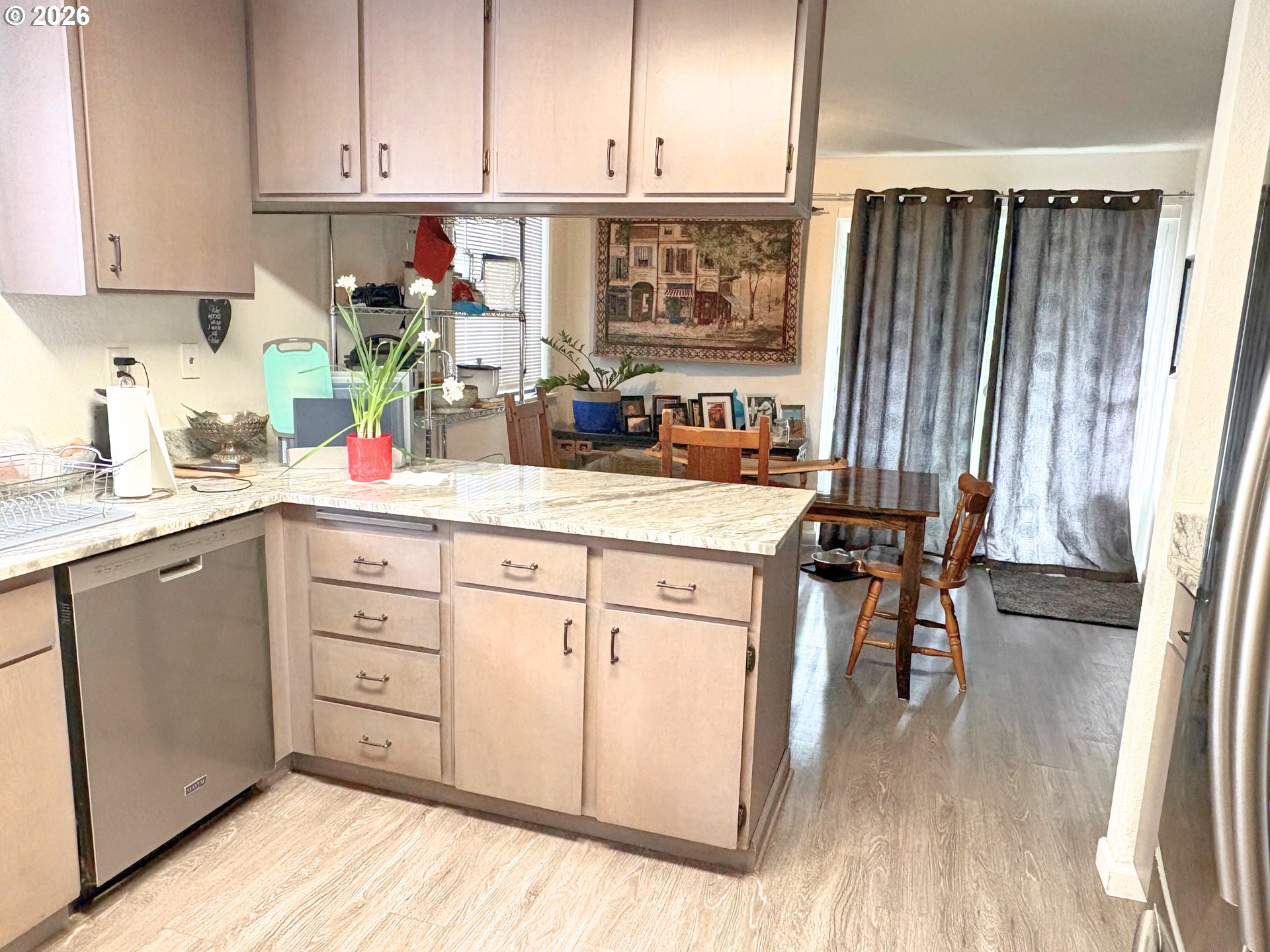1708 Jasper Avenue Sutherlin, OR 97479 - Photo 3 of 30 a kitchen with stainless steel appliances a stove top oven and a refrigerator