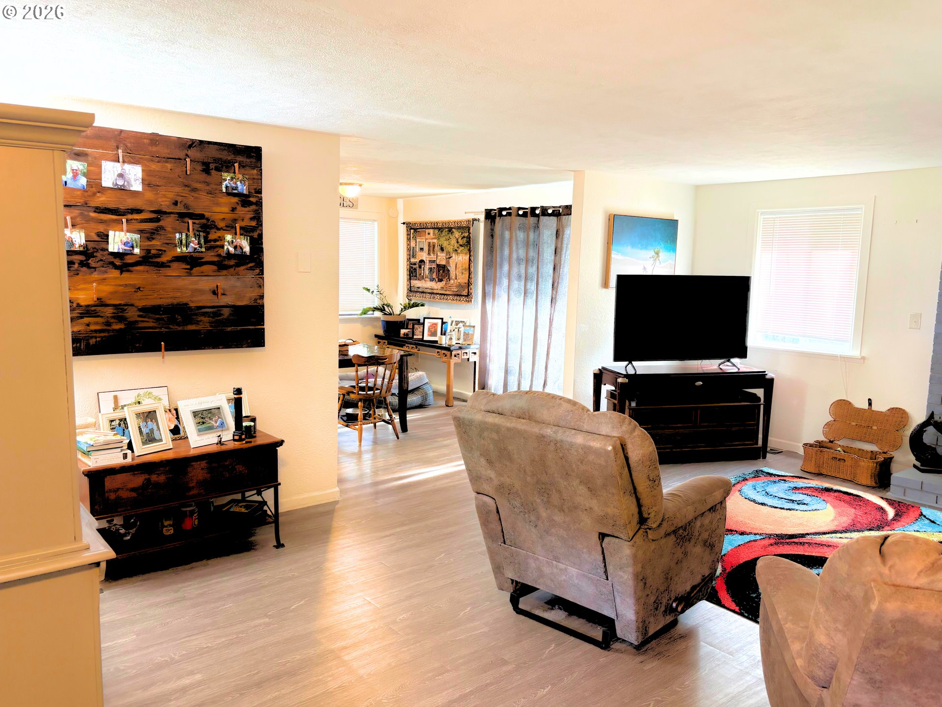 1708 Jasper Avenue Sutherlin, OR 97479 - Photo 8 of 30 a living room with furniture and a flat screen tv