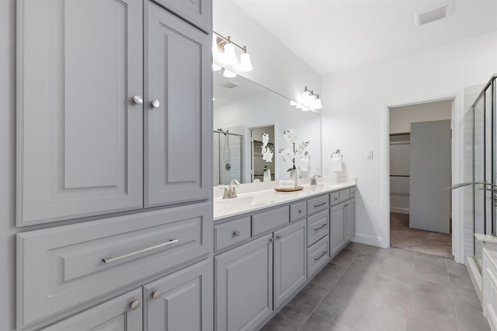 539 Farrell Lane Allen, TX 75013 - Photo 27 of 39 Bathroom featuring an extensive vanity with dual sinks and light gray cabinetry