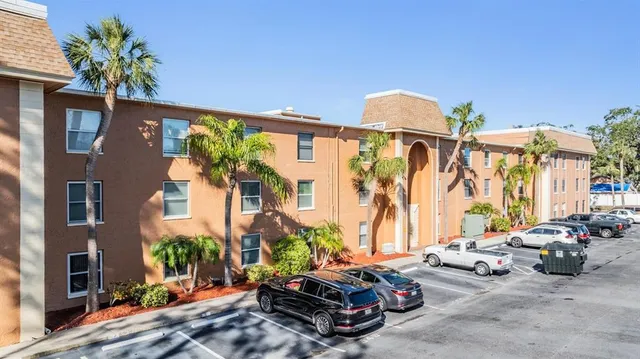 a car parked in front of a brick building
