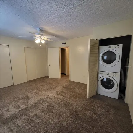 a view of a storage & utility room with a washer dryer