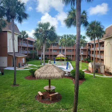 a view of a garden with a fountain