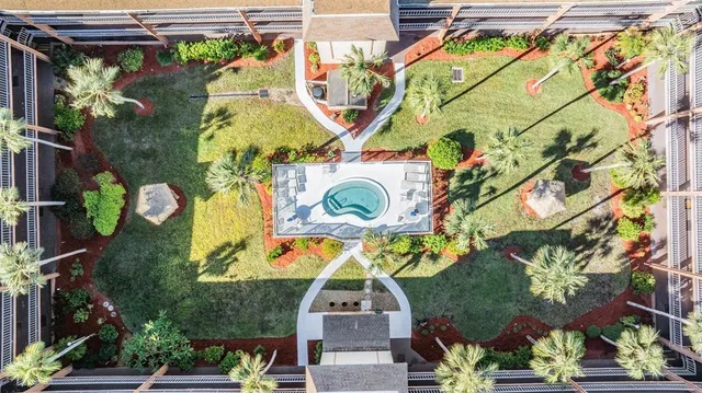 an aerial view of a houses with yard