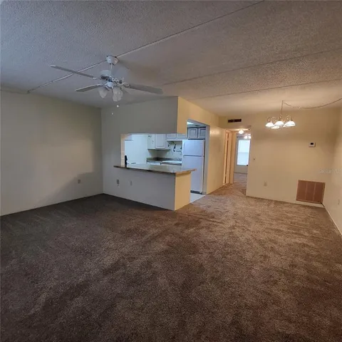 a view of a kitchen with a sink and a stove