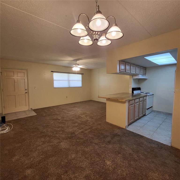 12760 Indian Rocks Road, Unit 540 Largo, FL 33774 - Photo 6 of 17 a kitchen with cabinets and window