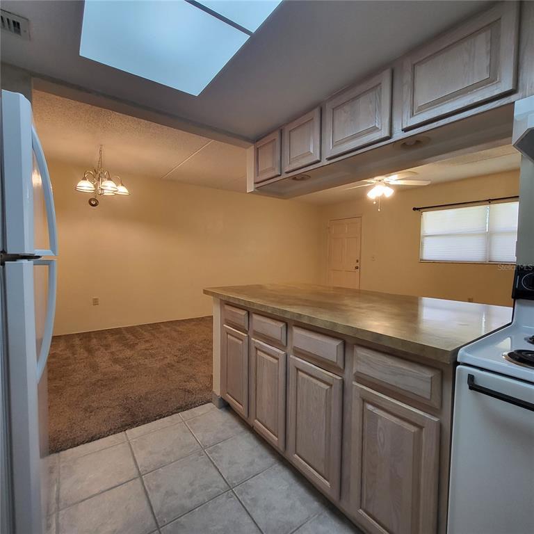 12760 Indian Rocks Road, Unit 540 Largo, FL 33774 - Photo 9 of 17 a kitchen with a sink and cabinets