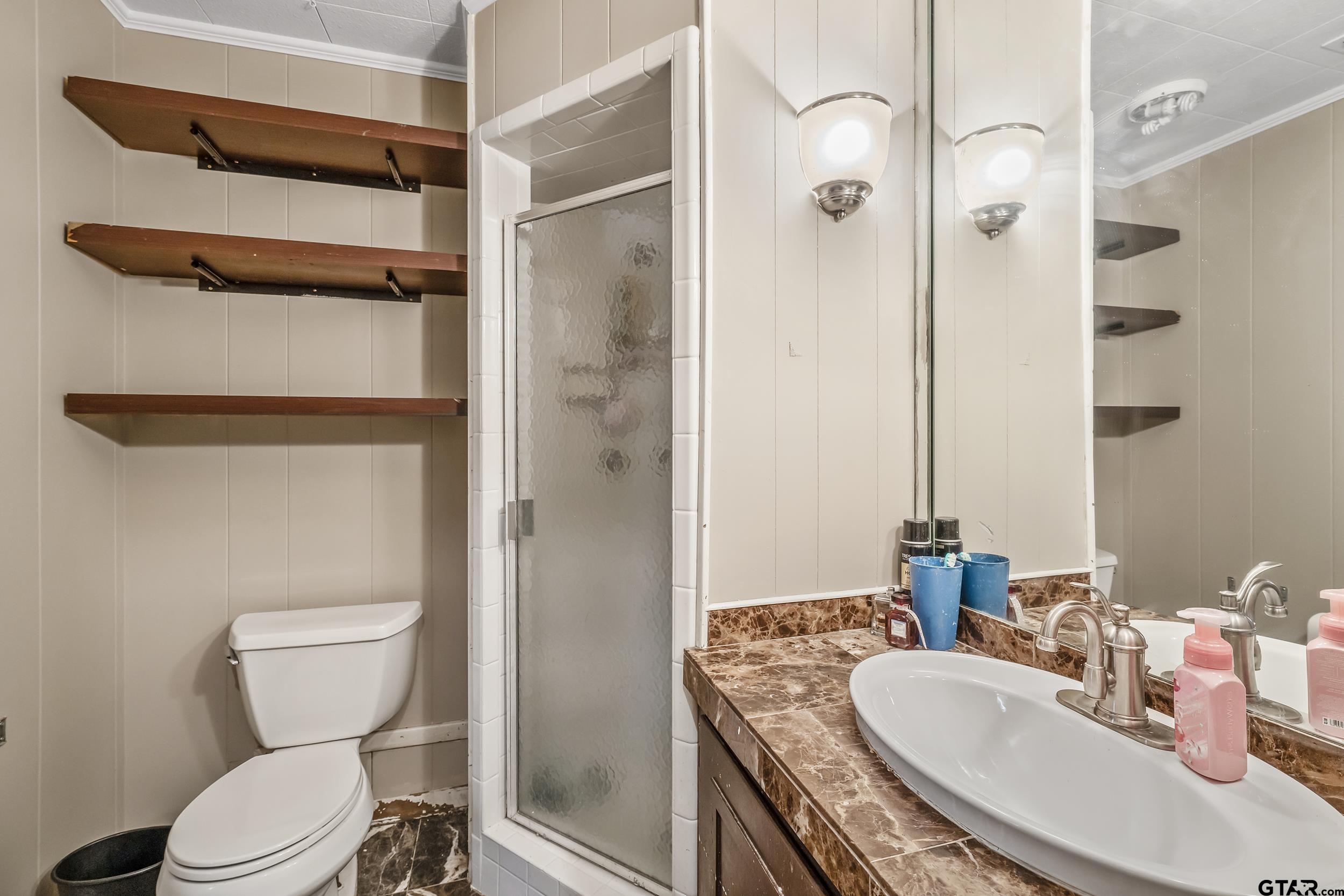 271 Nottingham Rusk, TX 75785 - Photo 13 of 23 a bathroom with a granite countertop toilet sink and shower