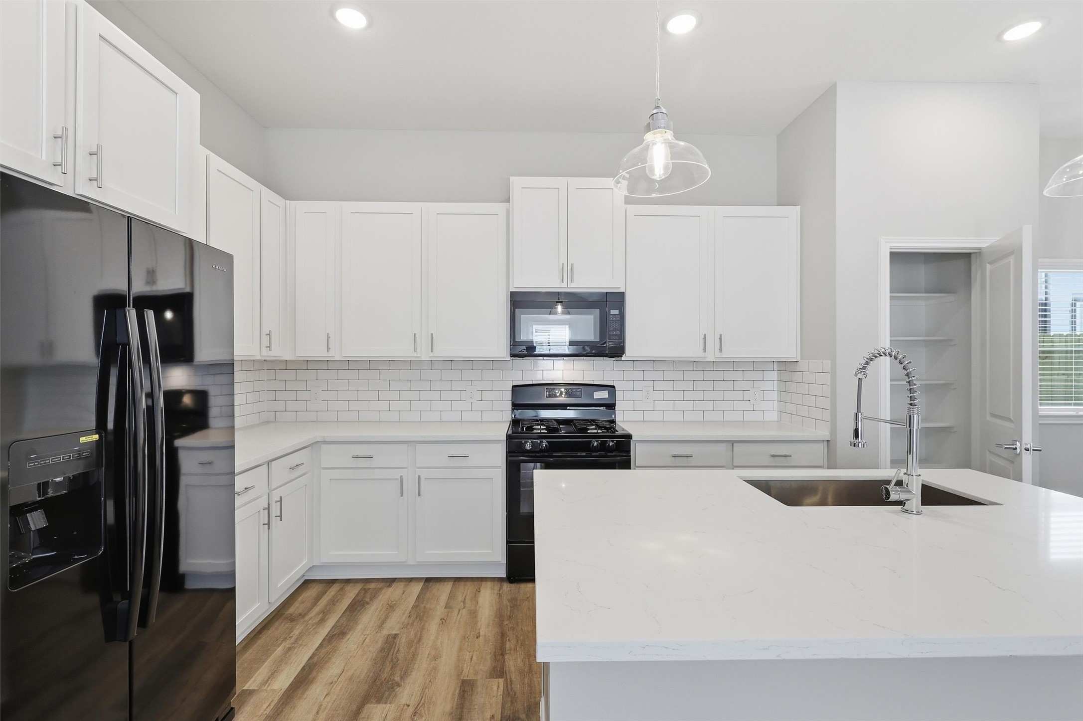 9912 Clark Road, Unit B Houston, TX 77076 - Photo 11 of 48 a kitchen with stainless steel appliances a sink stove and refrigerator