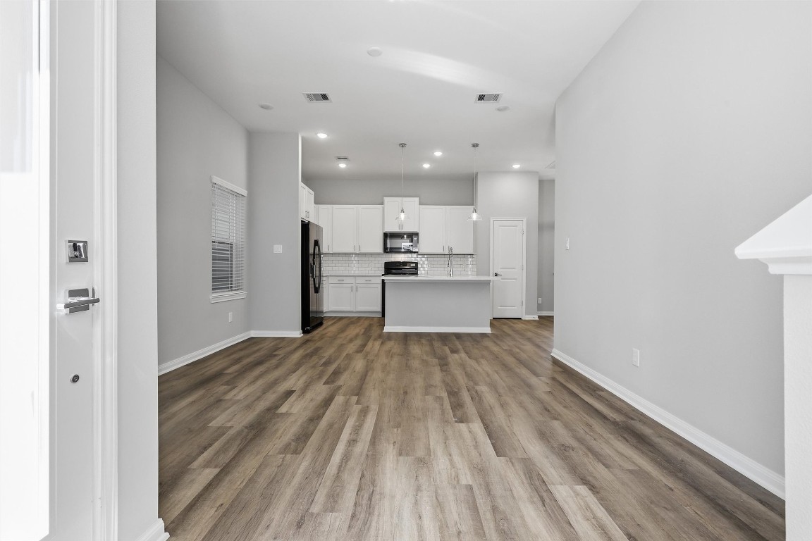 9912 Clark Road, Unit B Houston, TX 77076 - Photo 16 of 48 a view of kitchen with wooden floor