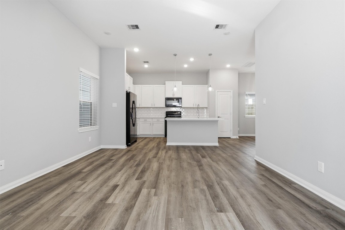 9912 Clark Road, Unit B Houston, TX 77076 - Photo 17 of 48 a view of kitchen with wooden floor
