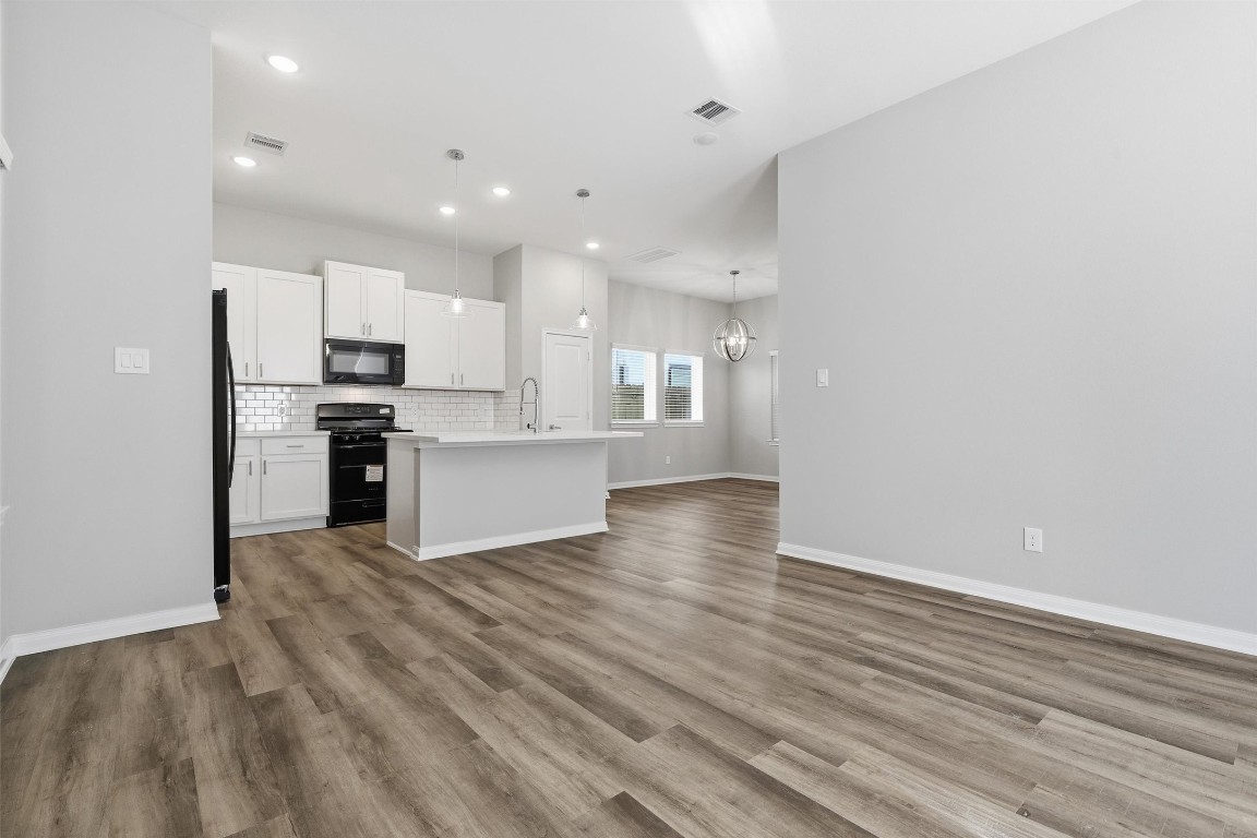 9912 Clark Road, Unit B Houston, TX 77076 - Photo 19 of 48 a view of kitchen with wooden floor