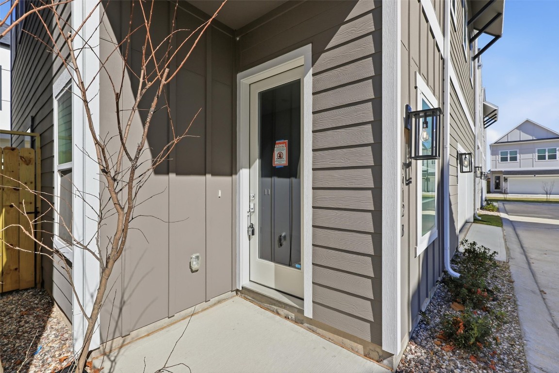 9912 Clark Road, Unit B Houston, TX 77076 - Photo 2 of 48 a view of a house with a door and wooden walls