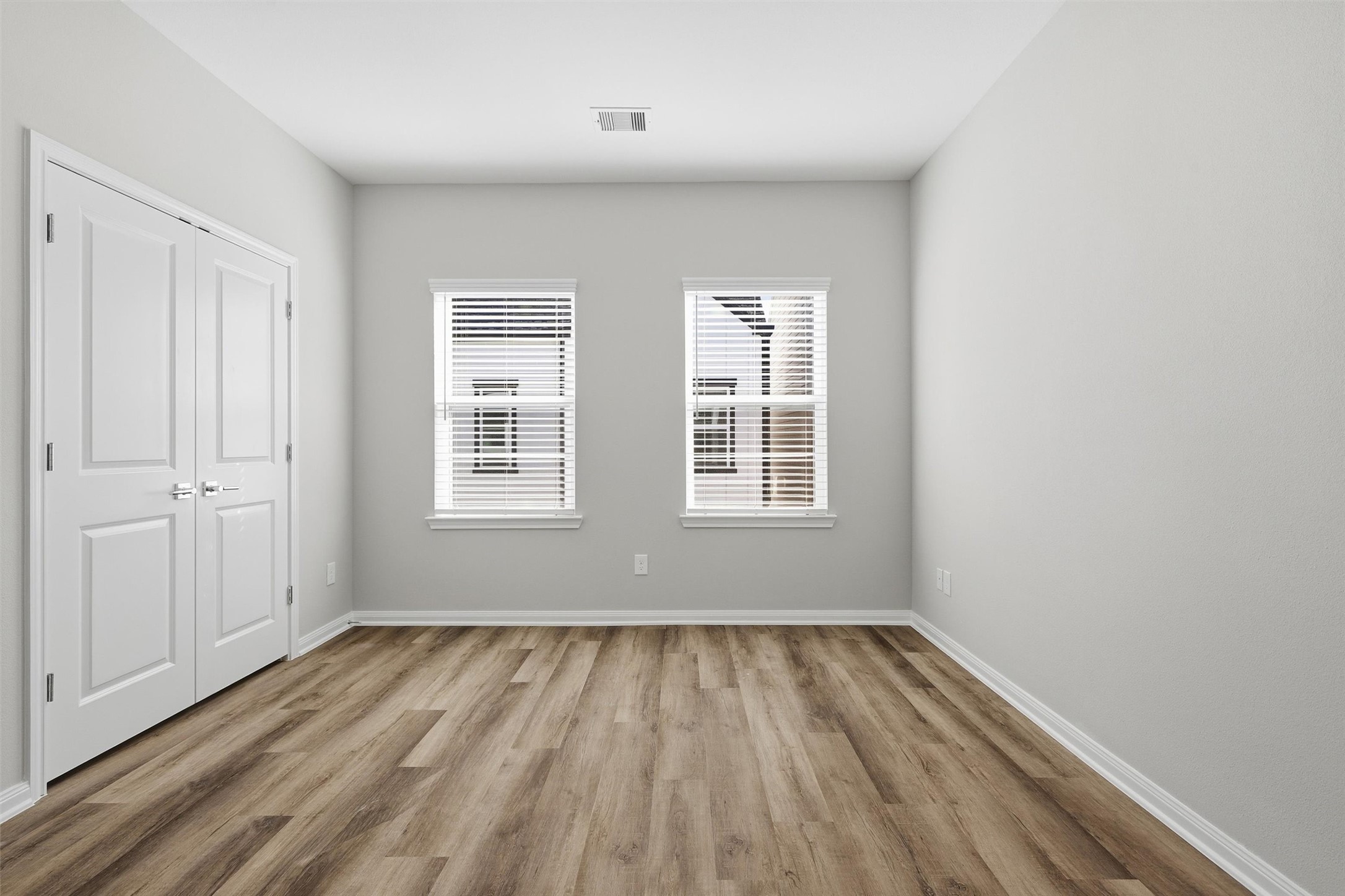 9912 Clark Road, Unit B Houston, TX 77076 - Photo 24 of 48 an empty room with wooden floor and windows