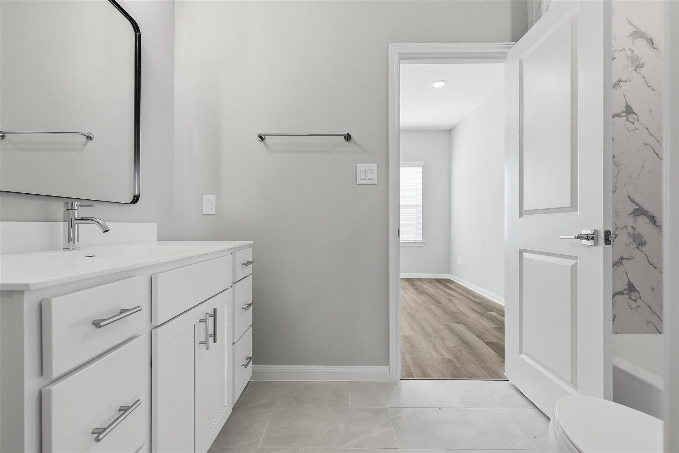 9912 Clark Road, Unit B Houston, TX 77076 - Photo 29 of 48 a bathroom with a sink and a mirror