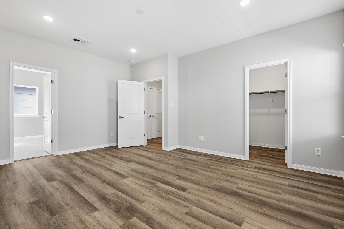 9912 Clark Road, Unit B Houston, TX 77076 - Photo 36 of 48 a view of an empty room with wooden floor