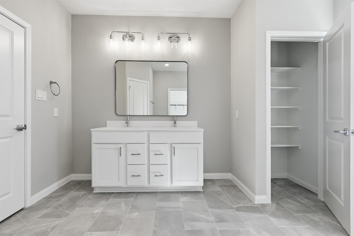 9912 Clark Road, Unit B Houston, TX 77076 - Photo 40 of 48 a view of a hallway with a mirror and cabinets