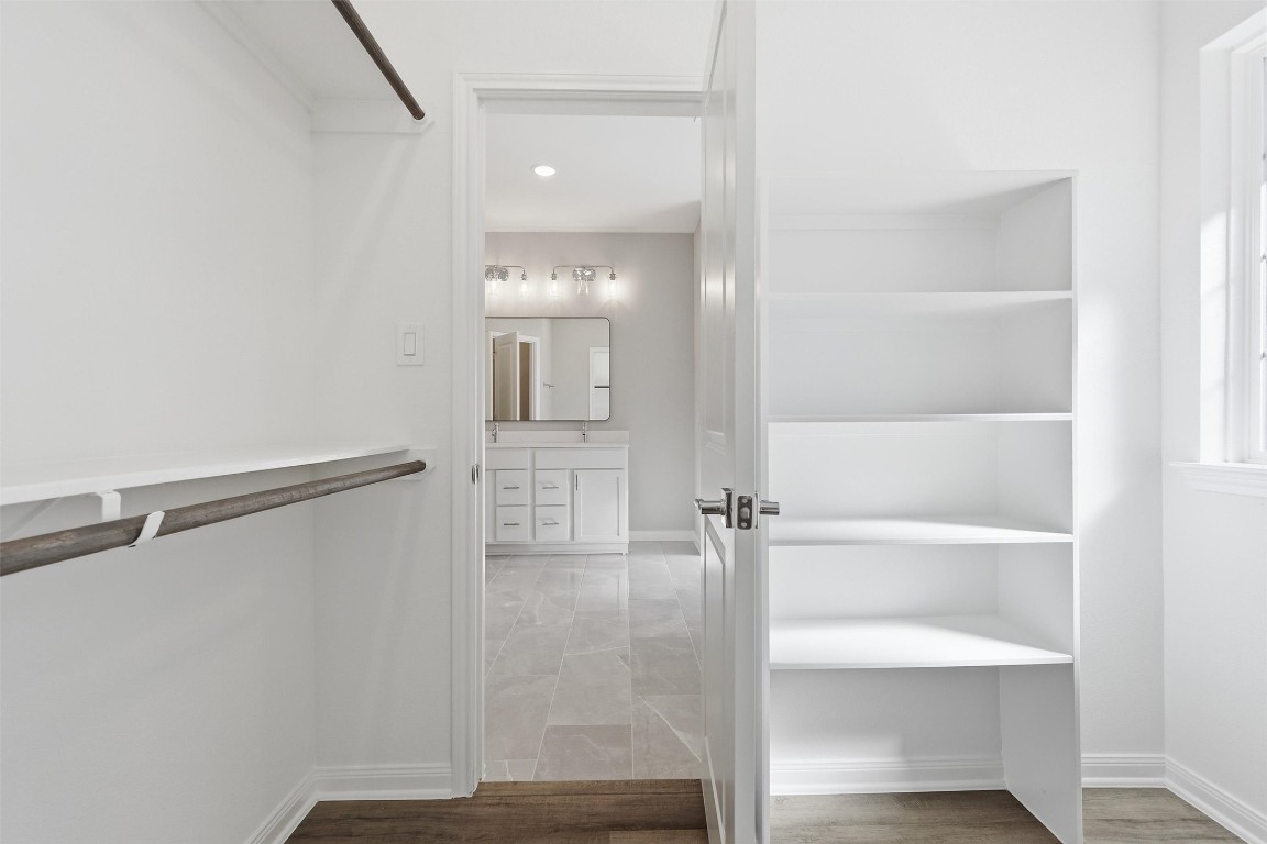 9912 Clark Road, Unit B Houston, TX 77076 - Photo 43 of 48 a bathroom with a glass shower door