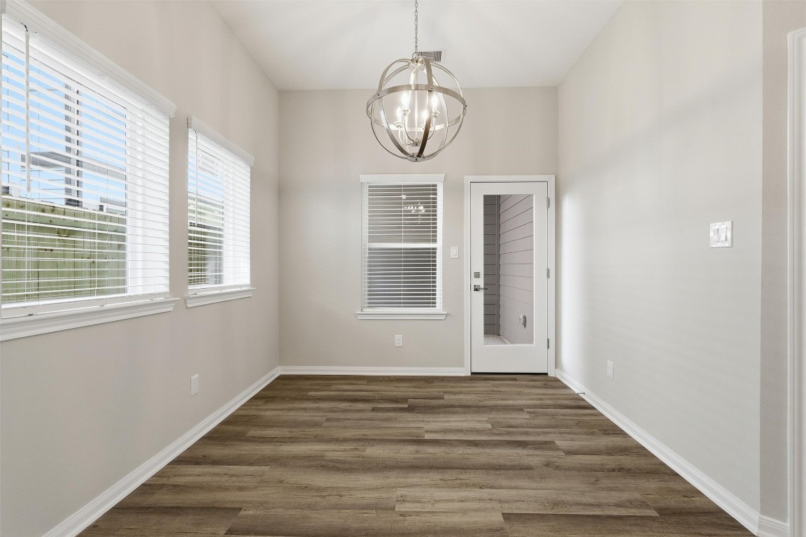 9912 Clark Road, Unit B Houston, TX 77076 - Photo 44 of 48 a view of empty room with wooden floor and fan