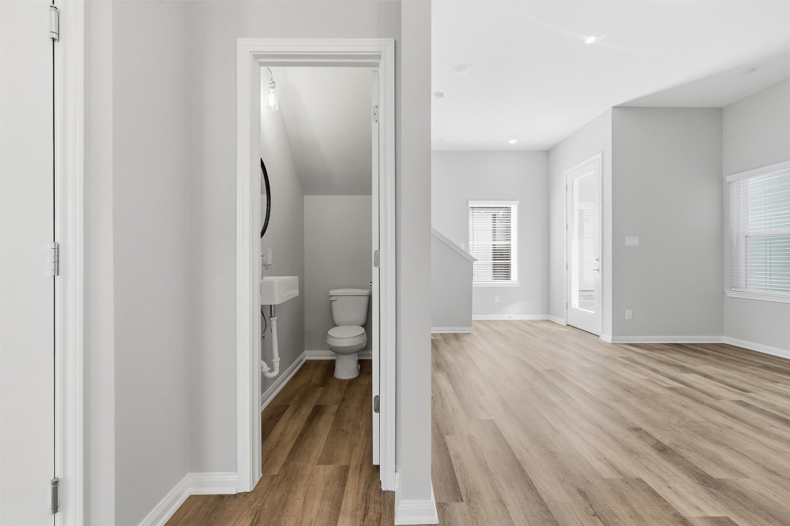 9912 Clark Road, Unit B Houston, TX 77076 - Photo 45 of 48 a view of a room with wooden floor and a bathroom