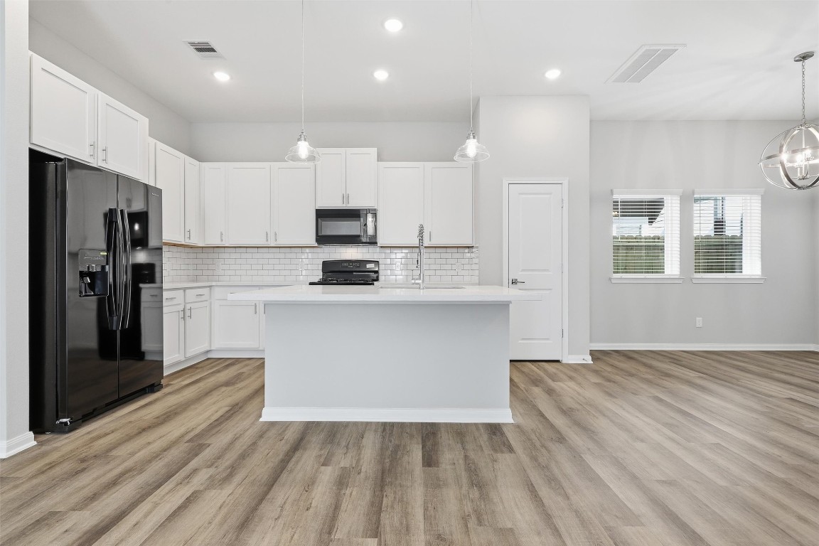 9912 Clark Road, Unit B Houston, TX 77076 - Photo 7 of 48 a kitchen with stainless steel appliances a refrigerator sink and microwave