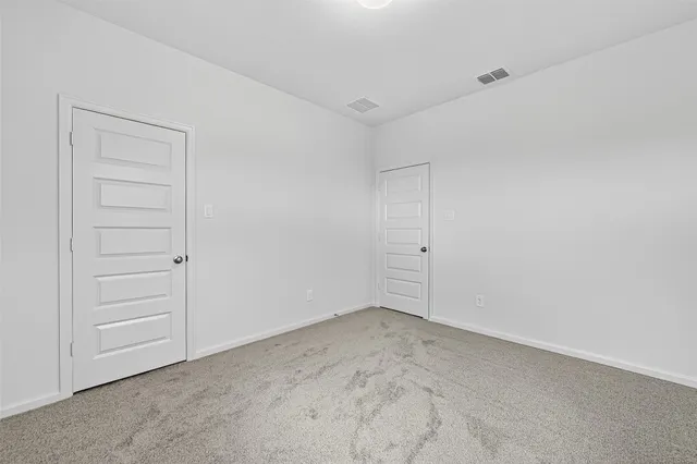 a bathroom with a sink vanity mirror and toilet