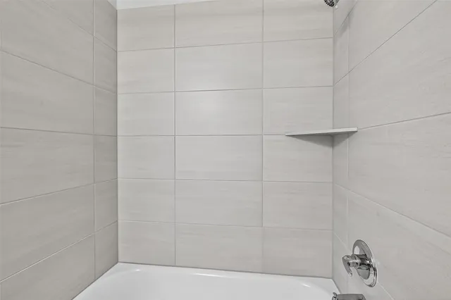 a bathroom with a sink vanity and a mirror