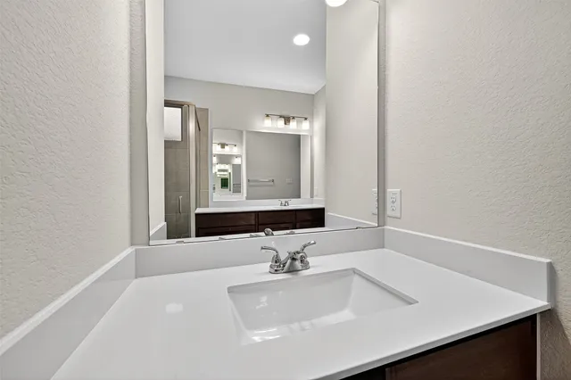 a view of a backyard with a garden and deck