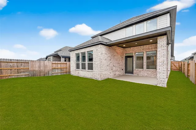a view of a back yard of the house